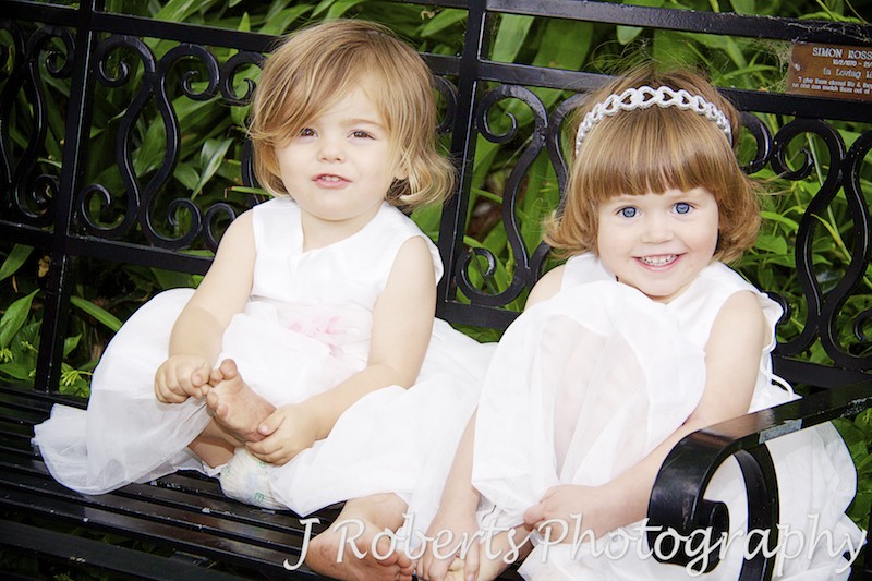 Little flowers girls on garden bench - wedding photography sydney